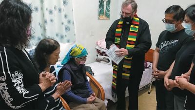 Fr. Larry Barnett with Granny MaHong, seated wearing head scarf